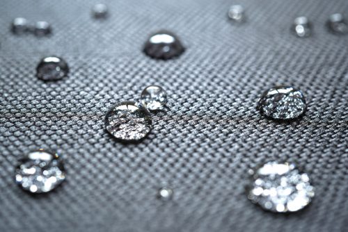 Waterproof coating background with water drops